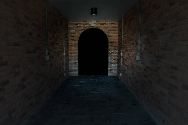 istock Red ancient archway brick isolated on black background 1707044751