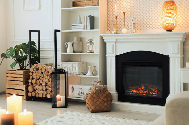 istock Stylish living room with beautiful fireplace and different decor. Interior design 1707045923