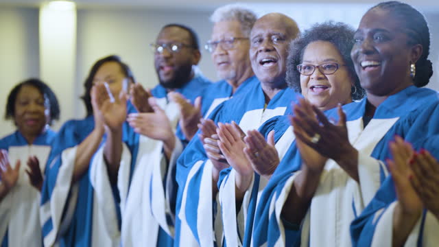 Black men and woman singing in church choir