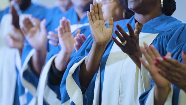 Cropped view of black men and women singing in choir