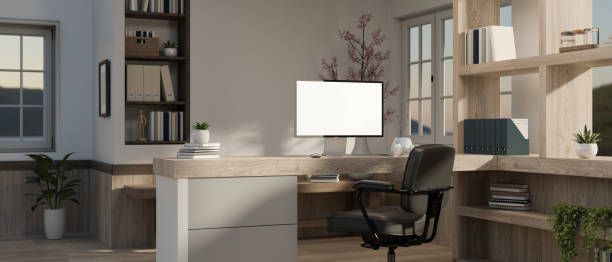 istock Interior design of a beautiful modern office with a computer on a counter desk and an office chair. 1707062491
