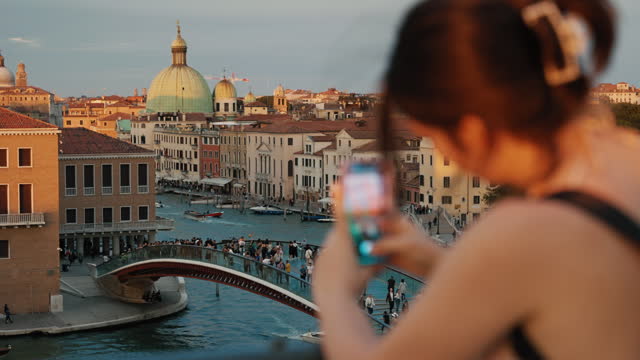 SLO MO Female Tourist With Smartphone Photographing Arch Bridge over Grand Canal near Buildings in Venice