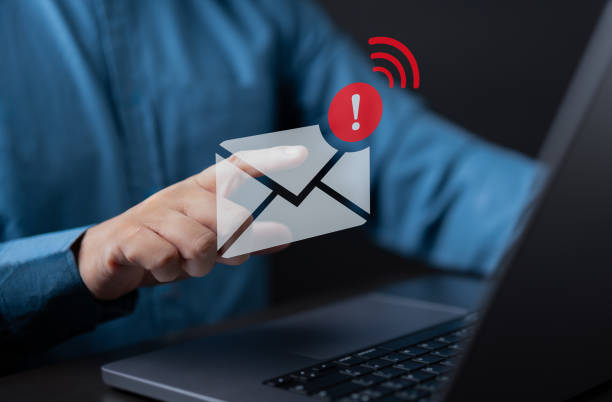 istock Businessman using laptop and touching on virtual icon white newsletter for electronic mail or E-mail with notification alert, online promotion, subscribe marketing, network communication technology. 1707074746
