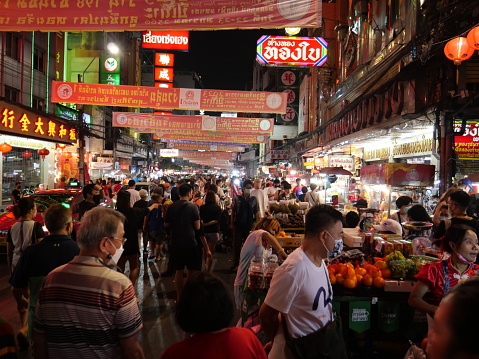 Bangkok, Thailand-January 23, 2023: People walking around Chinatown during Lunar New Year in Bangkok. It is a World's most renowned street food destination. It is famous for street food, dining, and lively environment.