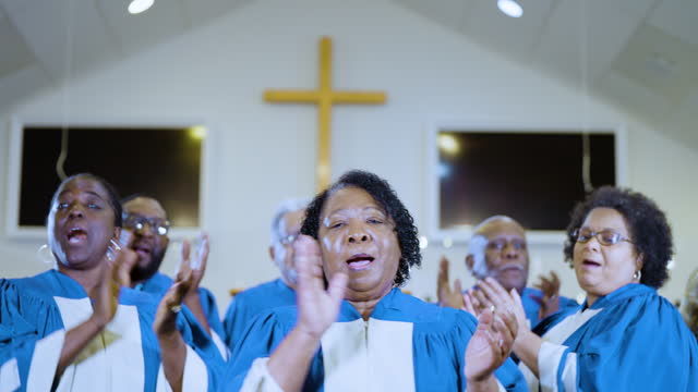 Senior African-American woman singing in church choir