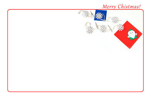 Christmas frame with red and dark blue origami paper, snowflakes and Origami Santa Claus,