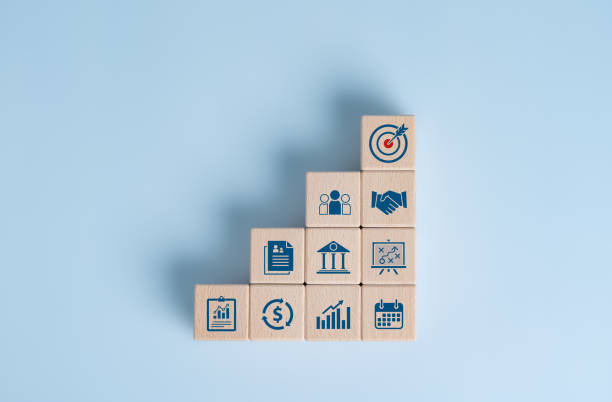 istock Organization successful, company cooperate, works improve for common target in organization. Technology to develop work, business progress for the best results. Wooden cubes with business goal icons. 1707082258