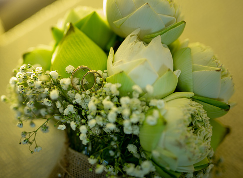Wedding flowers and wedding rings, lotus wedding flowers.