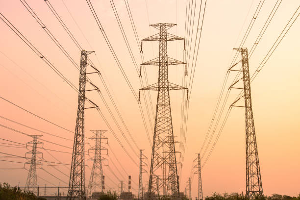 istock silhouette high voltage pole on sky sunset background. 1707156851