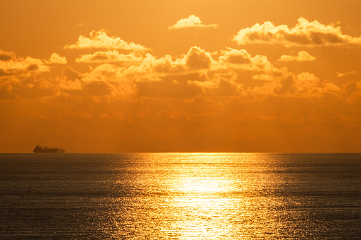 Dramatic shows of golden orange, yellow and red at dusk and dawn over the Bahama Islands in the North Atlantic Ocean