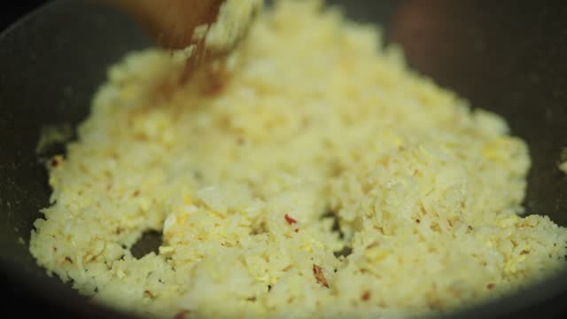 Making egg fried rice.