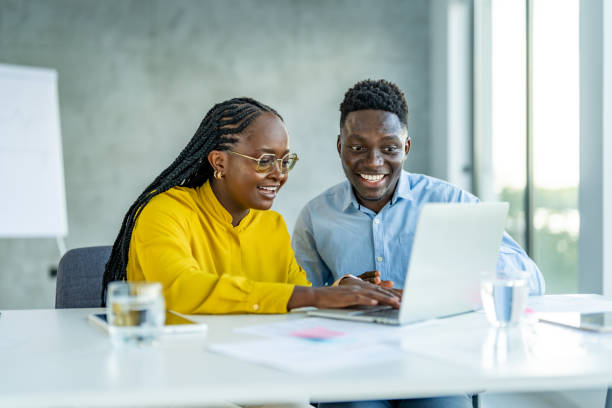 istock Smiling professional business people working together on new business strategy. 1707282976