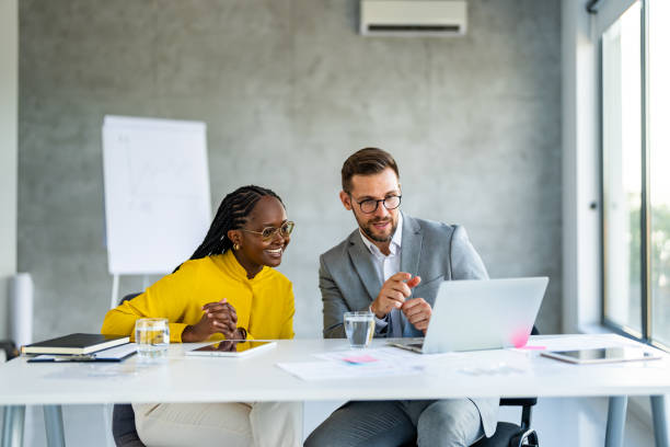 istock Man boss speaking with his female colleague. 1707284060
