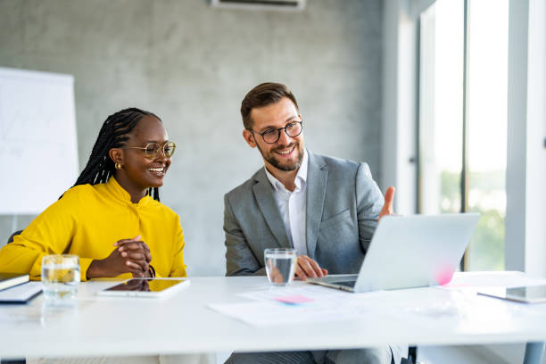 istock Colleagues meeting in office and discussing over a report 1707284580