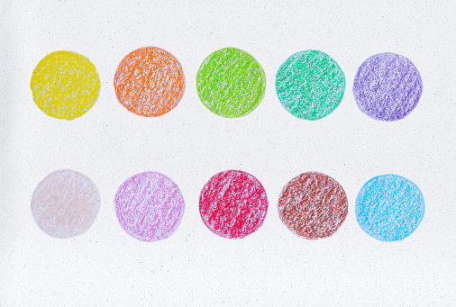 Colorful of crayon seamless circle on paper drawing background. Wax crayon hand drawing on paper.