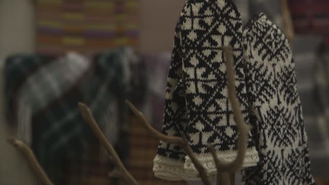 beautiful mittens on the background of patterned blankets