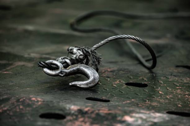 istock metal hook with cable for towing, pulling and lifting heavy objects in the workshop. close-up view 1707326595