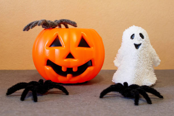 istock Jack-O'-Lantern pumpkins, ghost and spiders on Halloween 1707355412