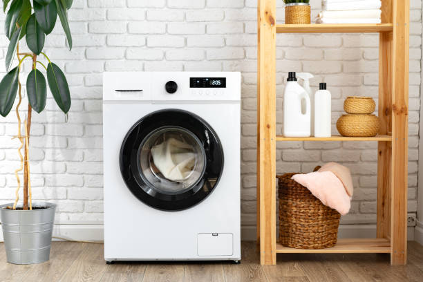 istock Modern white washing machine close up photo 1707355417
