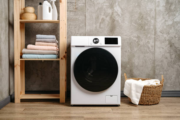 istock Washing machine in a gray modern laundry room 1707372940