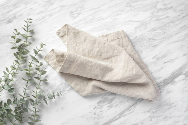 istock Linen napkin on natural marble kitchen table 1707380319