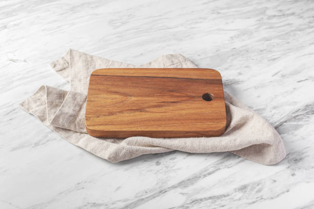 istock Wooden board on linen napkin on marble background 1707381509