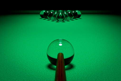 Glass billiard balls at the starting playing position.