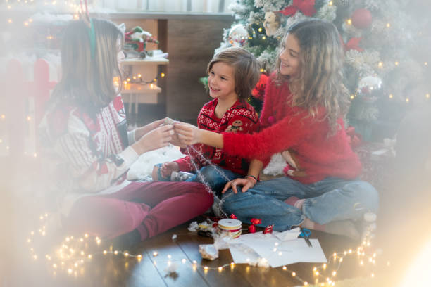 istock Children making Christmas ornaments at home 1707396441