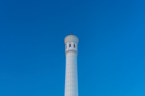 Muslim mosque with white trim and blue dome