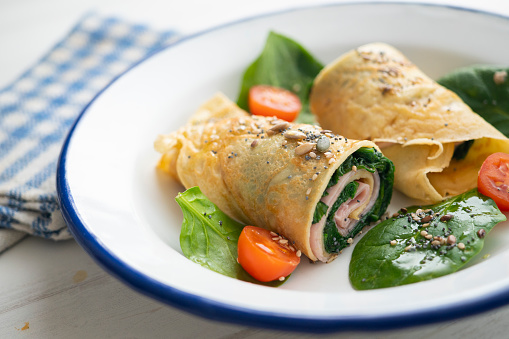 Crepe stuffed with ham and spinach..