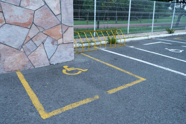 Free picture: Parking lot with a yellow wheelchair symbol, a handicap ...