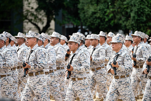 PUTRAJAYA, MALAYSIA - AUGUST 31, 2023 : Malaysian military personnel march during National Day celebration parade in Putrajaya. Celebrating the 66th anniversary of independence or Merdeka Day.