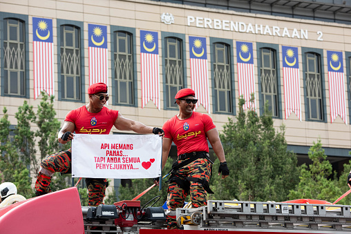 Putrajaya, Malaysia - August 31, 2023: A close up view of Fire Fighter Enforcement Agency  marching with vehicle on 66th anniversary of Independence Day or Merdeka Day.