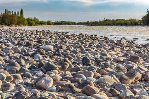 Background with river and stone shore