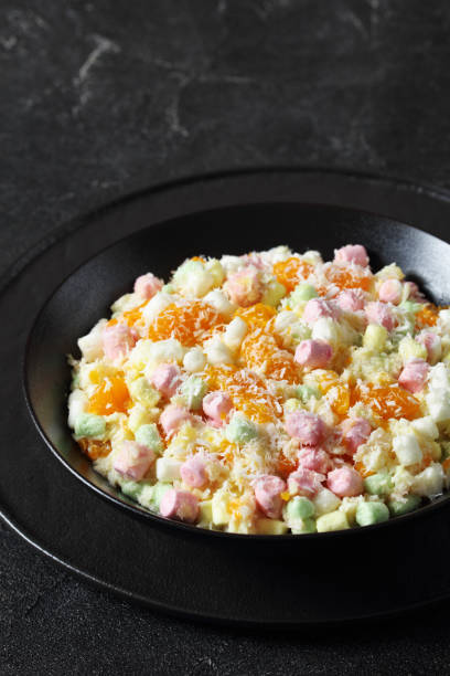 istock Ambrosia Salad in black bowl, top view 1707495844