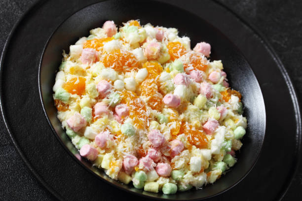 istock Ambrosia Salad in black bowl, top view 1707496952