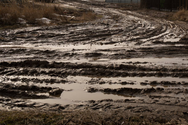 istock Dirt road after rain with deep tire tracks 1707511533