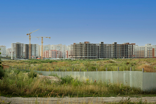 Construction site of a new residential houses. New city house building