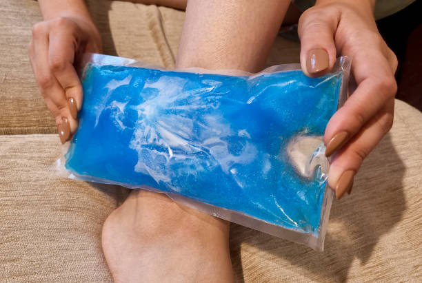 istock Hand Holding Ice Gel Pack On Ankle 1707520718