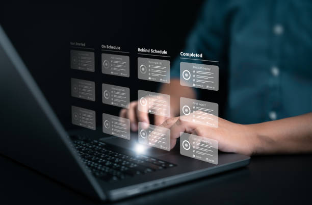 istock Planner and project handle application. Businessman or manager uses a laptop with responsible methodology boards and virtual interface screen. Process, workflow, task list, due date management tool. 1707524671