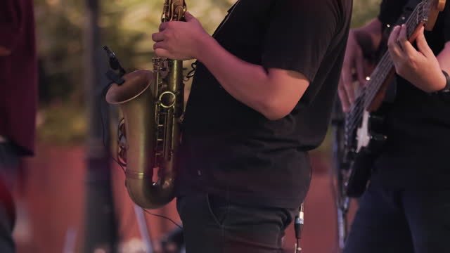 Musician playing saxophone in a party