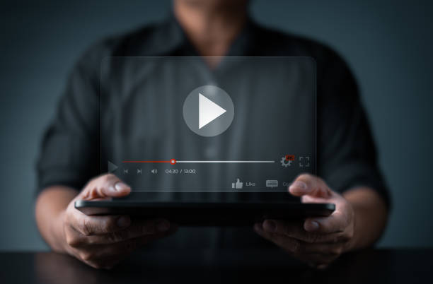 istock Online E-learning streaming. Businessman watch live content on tablet, seamless internet connection. Live playing broadcast video content via online technology. Relax or Self knowledge acquisition. 1707531497