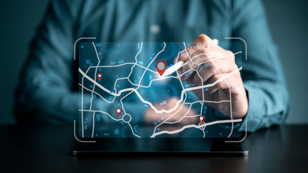 istock Businessman use tablet to search for address on world map with location points. Marking destination for travel maps and finding business places in online GPS Satellite coordinates system application. 1707531989
