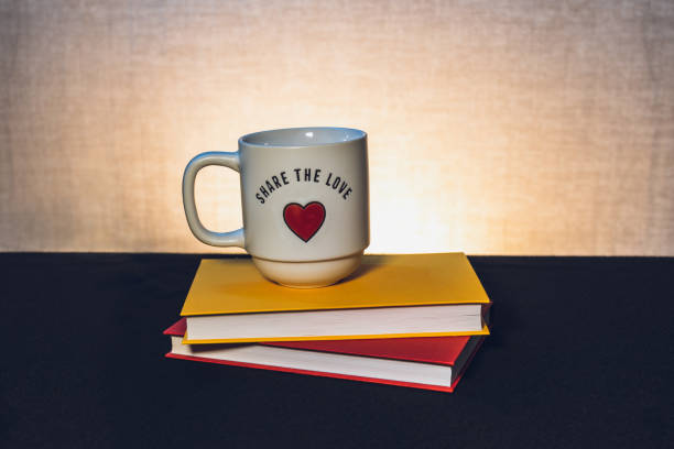 istock Mug with a book the theme of learning or creating a postcard 1707539513