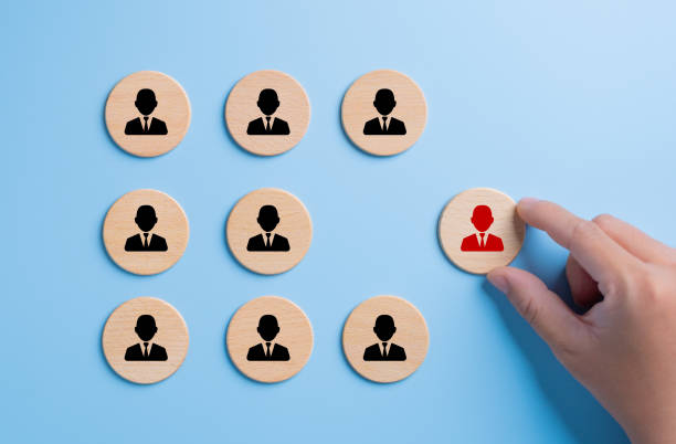istock Manager hand choosing human icon for resources recruiting online. Finding and searching for unemployed people for job interview. Effective team management, recruitment, training, hiring, performance. 1707564623