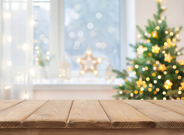 istock Empty table in front of christmas tree with decoration background 1707567468