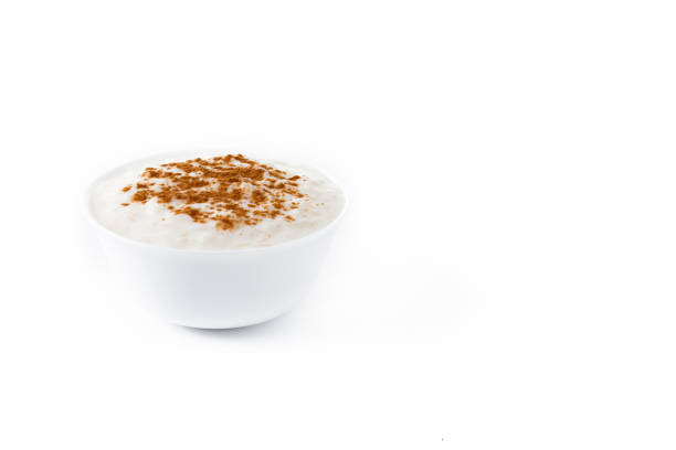 This image shows multiple servings of traditional Turkish rice pudding, known as “fırın sütlaç,” presented in square metallic trays. Each portion has a characteristic caramelized surface created by oven-baking, resulting in a mix of light and dark browned areas. The repetitive layout highlights the preparation style commonly found in Turkish restaurants, bakeries, and dessert shops. The visual emphasizes culinary tradition, batch production, and the distinct texture and flavor profile of this well-known dessert. This imagery is suitable for use in restaurant menus, cultural food features, culinary blogs, or promotional materials showcasing authentic Turkish cuisine.