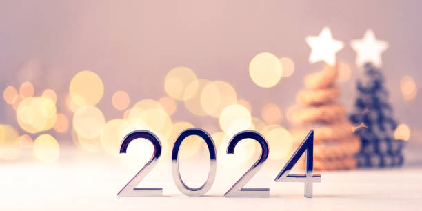 istock Metal numbers 2024 on table with bokeh lights. 1707602544