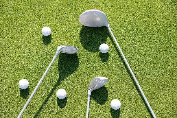 istock Golf clubs and balls lie on grass 1707603614