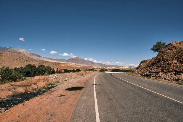 istock Empty winding road through mountain ridge in Central Asia 1707616641
